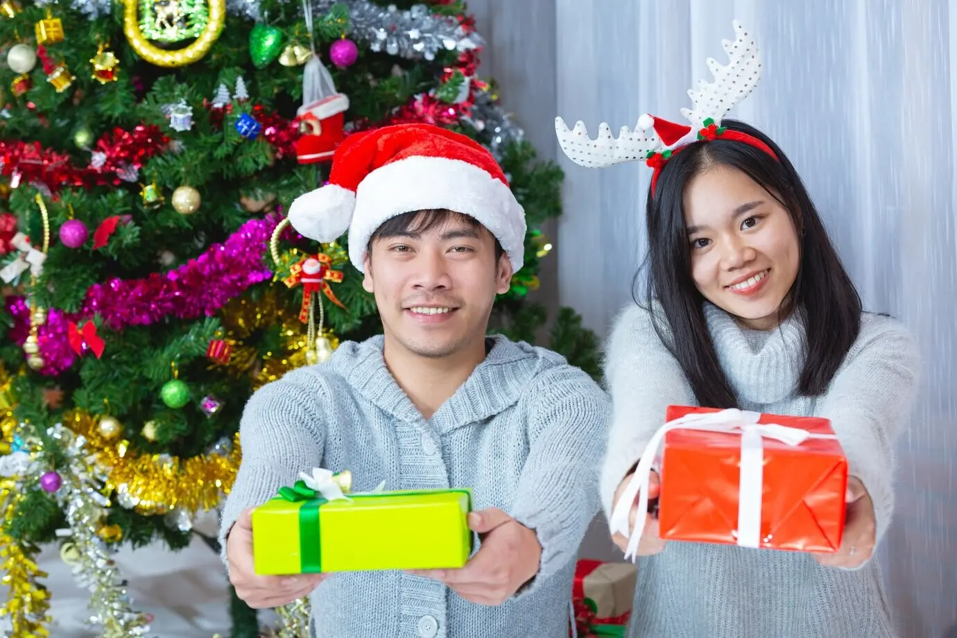 Couples enjoying a Christmas present